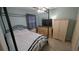 Comfortable bedroom with a black metal canopy bed frame, closet, and dresser at 913 Lake Lindley N Dr, Deland, FL 32724