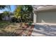 Home exterior featuring a well-manicured yard with flower beds at 913 Lake Lindley N Dr, Deland, FL 32724