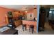 Cozy kitchen with wood cabinets, stainless steel appliances, and a breakfast bar at 913 Lake Lindley N Dr, Deland, FL 32724