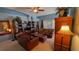 Comfortable living room featuring lots of seating, a ceiling fan and a large window at 913 Lake Lindley N Dr, Deland, FL 32724