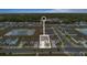 Aerial view of the neighborhood showcasing a new home near a pond and green spaces at 9392 Revere Ave, Leesburg, FL 34788