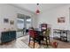 Cozy dining area with sliding glass doors offering plenty of natural light and backyard access at 9392 Revere Ave, Leesburg, FL 34788