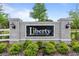 Community entrance sign with manicured landscaping at 9392 Revere Ave, Leesburg, FL 34788