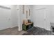 Bright entryway with a decorative bench, creating a welcoming and functional space for guests at 9392 Revere Ave, Leesburg, FL 34788