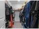 Organized walk-in closet with shelving and ample storage space for clothes and accessories at 9392 Revere Ave, Leesburg, FL 34788