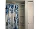 Bathroom shower with white shower stall and curtain with butterfly and floral print at 130 Oak Tree Dr, Debary, FL 32713