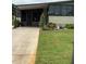 Inviting home with a convenient carport, screened-in porch, and well-kept lawn at 130 Oak Tree Dr, Debary, FL 32713