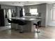 Kitchen featuring stainless steel appliances, modern countertops, and stylish bar stool seating at 130 Oak Tree Dr, Debary, FL 32713