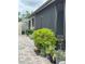 Landscaping featuring lush plants and a brick walkway alongside the home at 130 Oak Tree Dr, Debary, FL 32713