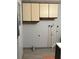 Laundry room with upper cabinets and hookups for washing machine and dryer at 130 Oak Tree Dr, Debary, FL 32713