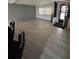 Spacious living room featuring wood floors, ample natural light, and a welcoming atmosphere at 130 Oak Tree Dr, Debary, FL 32713