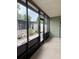 Enclosed patio with plenty of natural light and a great view of the outdoors at 130 Oak Tree Dr, Debary, FL 32713