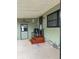 Lovely patio with an overhang featuring a sign and newly stained wooden steps at 130 Oak Tree Dr, Debary, FL 32713