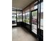 Screened porch with outdoor seating and a view of the backyard at 130 Oak Tree Dr, Debary, FL 32713