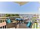 Condo balcony with seating area and lovely views of the water and the bridge at 100 Silver Beach Ave # 716, Daytona Beach, FL 32118