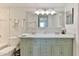 Bright bathroom with double sinks, a large mirror, and a beautifully tiled countertop at 100 Silver Beach Ave # 716, Daytona Beach, FL 32118