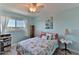 Relaxing bedroom featuring blue walls, coastal decor, and a ceiling fan for comfortable living at 100 Silver Beach Ave # 716, Daytona Beach, FL 32118