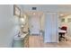 Condo entryway with light wood floors, a bureau, and access to other rooms at 100 Silver Beach Ave # 716, Daytona Beach, FL 32118
