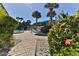 Tropical landscaping surrounds a pool and lounge area in this serene community at 100 Silver Beach Ave # 716, Daytona Beach, FL 32118