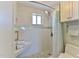 Updated shower with light tile, glass accents and a built-in bench for relaxation at 100 Silver Beach Ave # 716, Daytona Beach, FL 32118