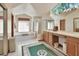 Bright bathroom with a vaulted ceiling, double vanity, and shower at 1033 Pearl Tree Rd, Deltona, FL 32725
