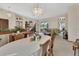 Elegant dining room featuring a crystal chandelier, neutral walls, and seamless transition to the living area at 1033 Pearl Tree Rd, Deltona, FL 32725