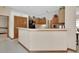 Well-equipped kitchen with wooden cabinetry, stainless steel appliances, and a breakfast bar at 1033 Pearl Tree Rd, Deltona, FL 32725