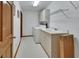 Functional laundry room with washer, dryer, sink, and ample storage at 1033 Pearl Tree Rd, Deltona, FL 32725
