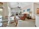 Inviting living room with a cozy fireplace, plush seating, and plenty of natural light at 1033 Pearl Tree Rd, Deltona, FL 32725