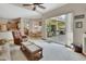 Open-concept living room offering views of the kitchen and dining area and a screened lanai at 1033 Pearl Tree Rd, Deltona, FL 32725