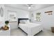 Bright bedroom with white walls, a blue headboard, and two windows that let in plenty of natural light at 104 Hester Ave, New Smyrna Beach, FL 32168