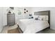 Bedroom with a comfortable bed, neutral decor, and access to the outside at 104 Hester Ave, New Smyrna Beach, FL 32168