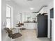 Eat-in kitchen includes white cabinets, modern appliances, and a cozy dining area at 104 Hester Ave, New Smyrna Beach, FL 32168