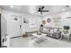 Inviting living room with light tile flooring, modern furniture, and stylish decor at 104 Hester Ave, New Smyrna Beach, FL 32168