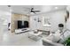 Cozy living room with modern decor, wood accent wall, and ample natural light at 104 Hester Ave, New Smyrna Beach, FL 32168