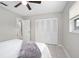 Bright bedroom with ample natural light, a closet, and soft decor elements, offering a peaceful retreat at 1044 Deltona Blvd, Deltona, FL 32725