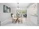 Cozy dining area featuring an open layout that connects to the kitchen and living room at 1044 Deltona Blvd, Deltona, FL 32725