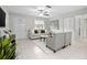 Bright living room featuring neutral tones, tile floors, and open layout at 1044 Deltona Blvd, Deltona, FL 32725