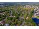 Aerial view of a residential area, showcasing lush greenery, serene pond, and neighborhood layout at 105 Laguna Ct, Sanford, FL 32773