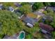 Aerial perspective of a cozy home, complete with a private backyard, patio, and lush, mature landscaping at 105 Laguna Ct, Sanford, FL 32773