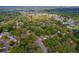 Expansive aerial view of a leafy residential neighborhood with mature trees and winding streets at 105 Laguna Ct, Sanford, FL 32773
