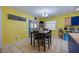 Bright dining area featuring a modern table set and an open layout with access to other living spaces at 105 Laguna Ct, Sanford, FL 32773