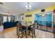 Cozy dining space connecting the living room and kitchen, with a dining table and seating for four at 105 Laguna Ct, Sanford, FL 32773