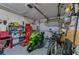 Well-equipped garage showcasing motorcycles, tools, and ample storage space at 105 Laguna Ct, Sanford, FL 32773