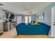 Inviting living room with a cozy blue sectional, a decorative fireplace, and a ceiling fan at 105 Laguna Ct, Sanford, FL 32773