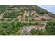 Expansive aerial view showcasing a community nestled among lush greenery, adjacent to water at 110 Cypress Woods Ct # 2B, Deltona, FL 32725