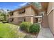 Charming two-story condo featuring shuttered windows and a well-maintained lawn at 110 Cypress Woods Ct # 2B, Deltona, FL 32725