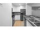 Charming kitchen features granite countertops, stainless steel appliances, and ample cabinet space at 110 Cypress Woods Ct # 2B, Deltona, FL 32725
