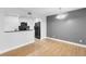Bright interior with a breakfast bar overlooking the kitchen's stainless steel appliances and black granite countertops at 110 Cypress Woods Ct # 2B, Deltona, FL 32725