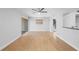 Bright living area with wood flooring, a ceiling fan, and sliding doors to the outside at 110 Cypress Woods Ct # 2B, Deltona, FL 32725